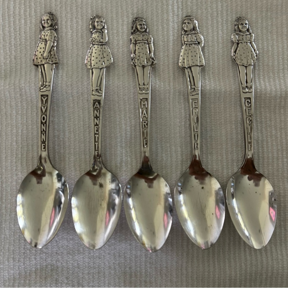 A SET OF DIONNE QUINTUPLET SPOONS
